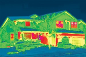 Infrared picture of house in winter showing energy loss